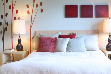 Contemporary bedroom in red and white.